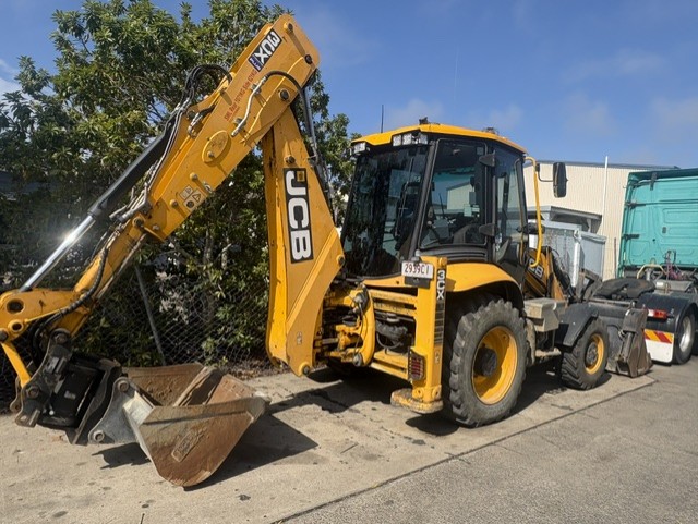 JCB backhoe loader parked at the workshop yard for earthmoving equipment repairs