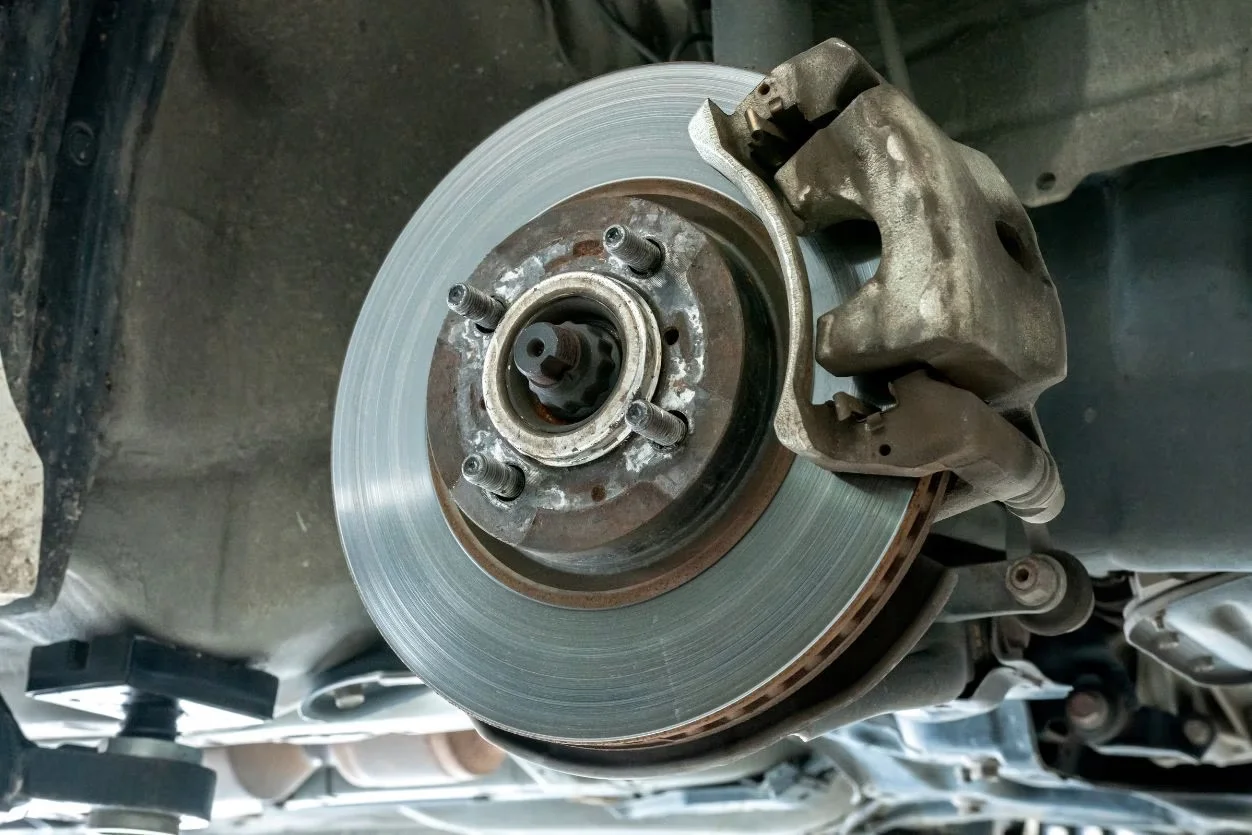 Disc brake rotor and caliper on a 4x4 during brake repairs