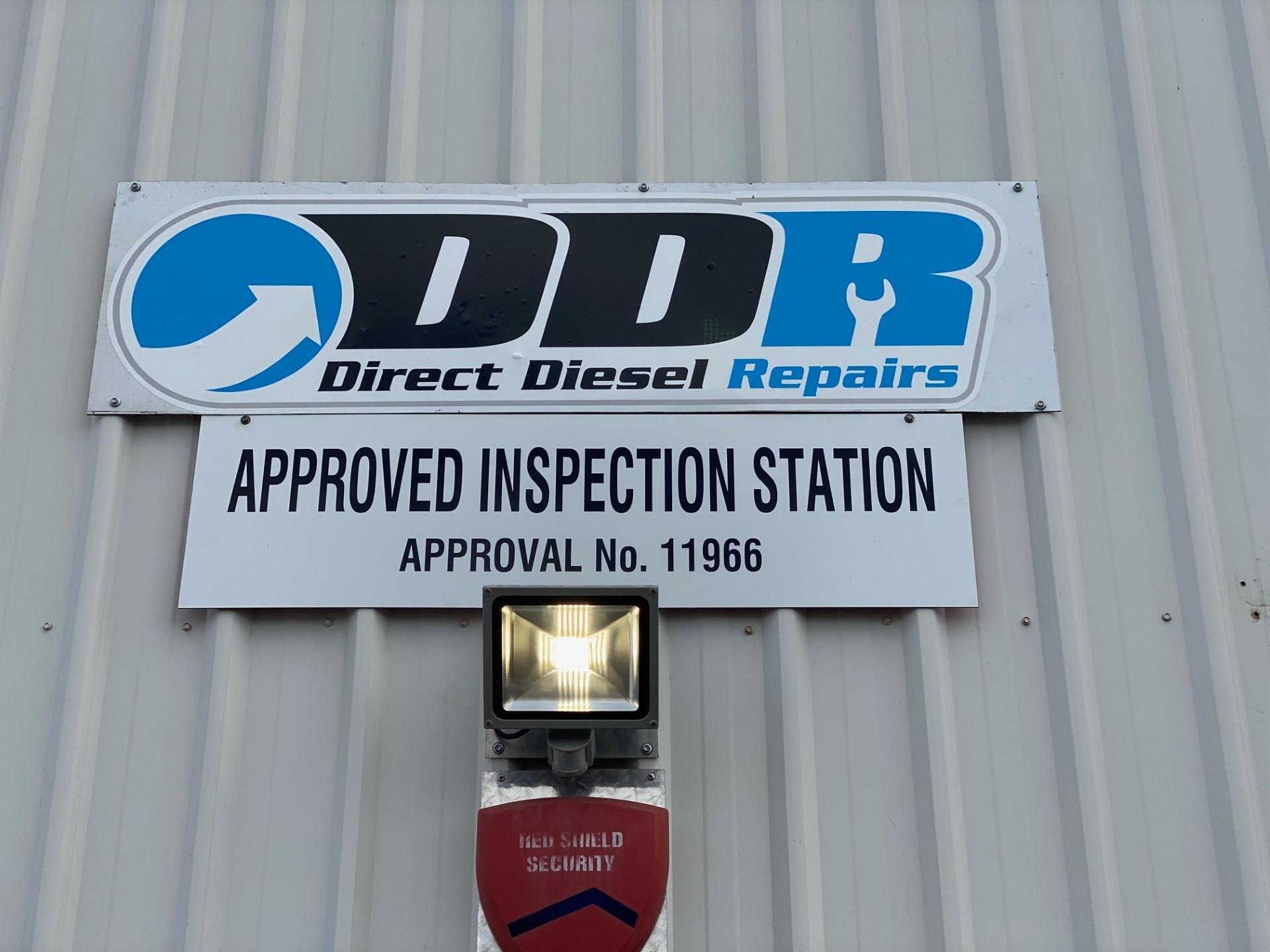 Direct Diesel Repairs workshop signage with Approved Inspection Station approval number 11966