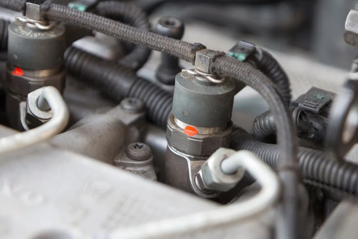 Diesel fuel injectors mounted in an engine during injection repairs